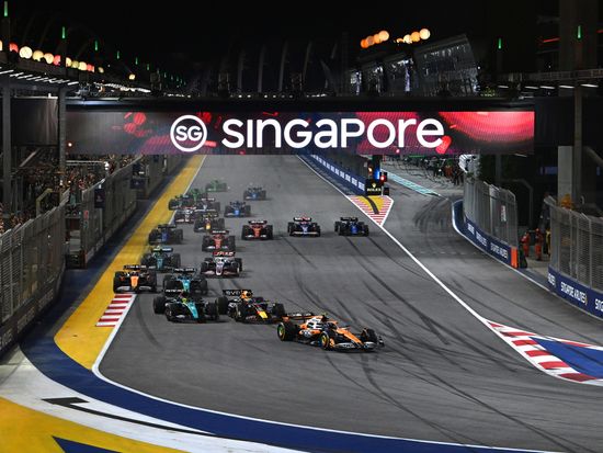 Cars jostle for position at Turn 1