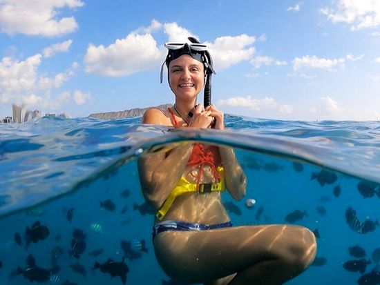 Girl Snorkeling with Fish