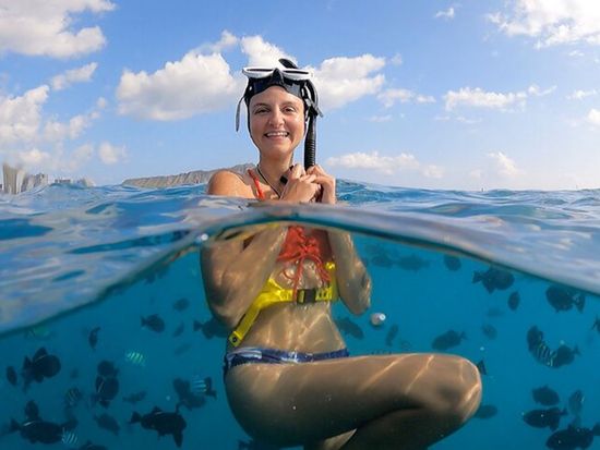 Girl Snorkeling with Fish