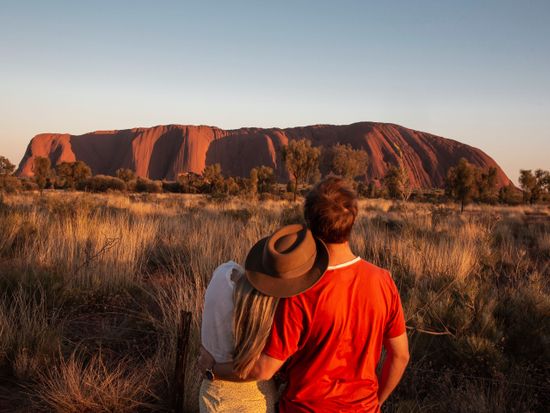 130202-35_Couple at Uluru Sunrise_Tourism Australia_Nicholas Kavo