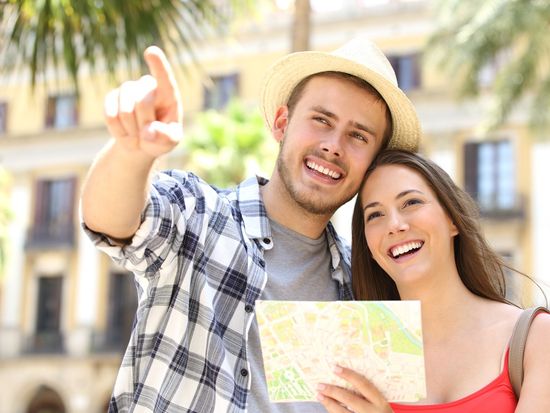 Couple_Looking_at_Map_in_Tropical_Place_