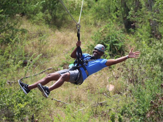 Enjoying the zipline adventure at Coral Crater