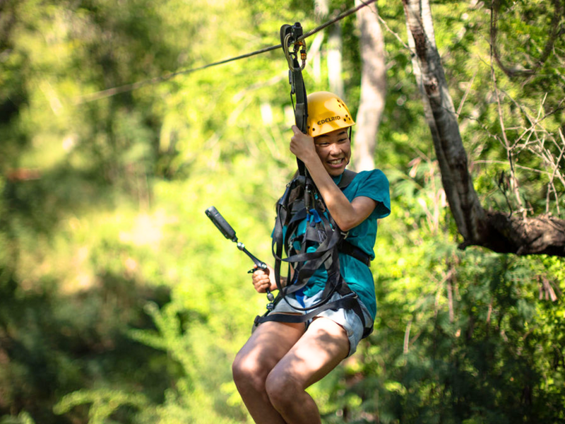 Capture memories as you zip through the lush jungle at Coral Crater Adventure Park