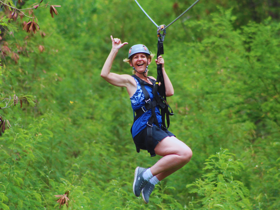 Zipline through the lush jungle forest