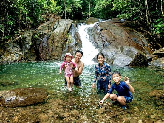 Family fun at a hidden jungle waterfall.