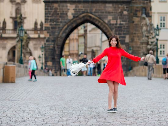 happy-young-urban-woman-in-european-city-on-the-fa-2025-02-11-19-47-26-utc